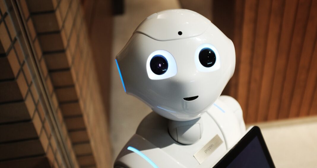 AI content generators like this cute white robot will not replace people but change how many people will work.