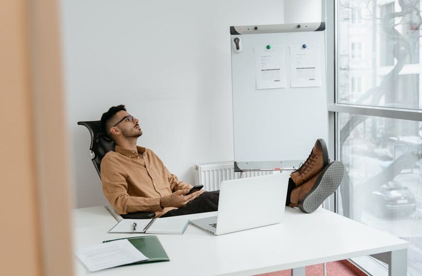 a man sitting in his office taking a microbreak