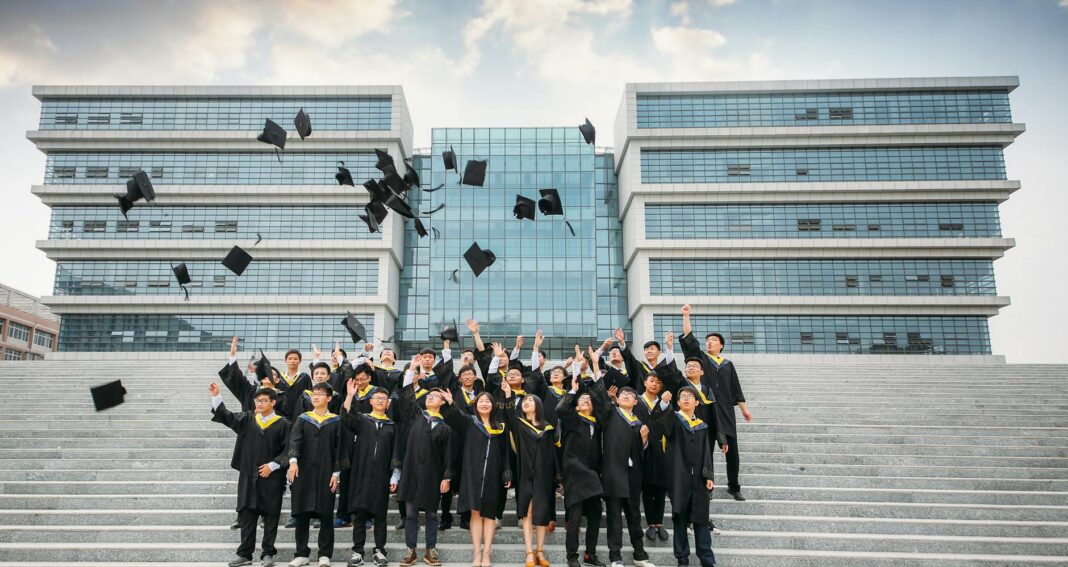 graduation celebration with cap toss outdoors