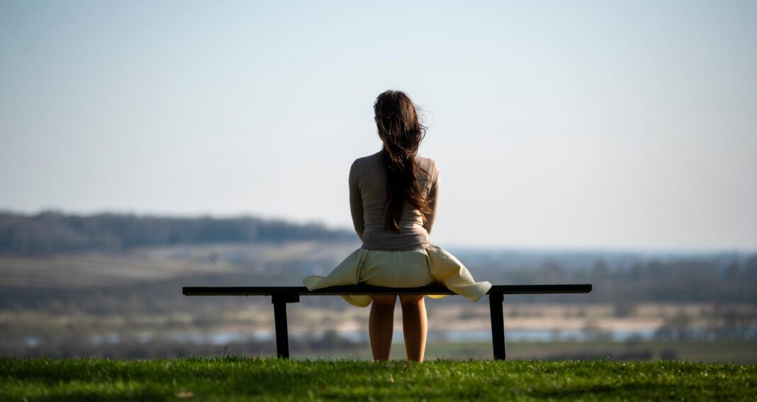 a woman sitting on the bench