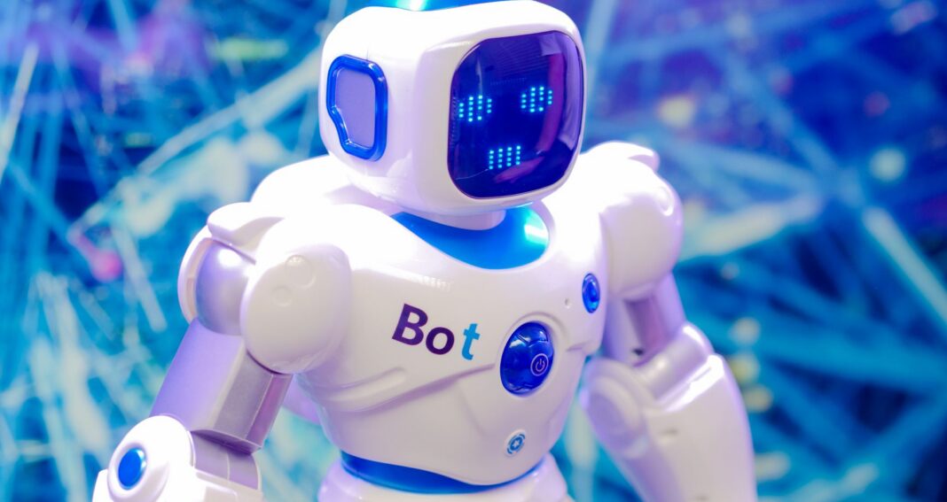 white and blue robot toy on blue string lights