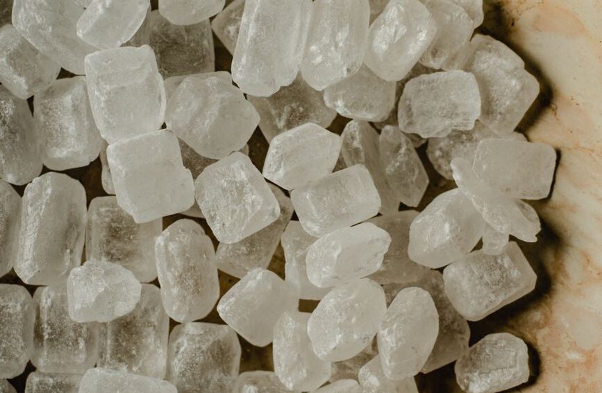 A close up shot of sugar crystals on a plate