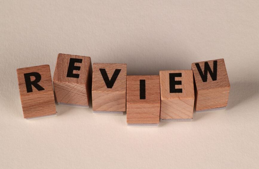 wooden blocks spelling the word review